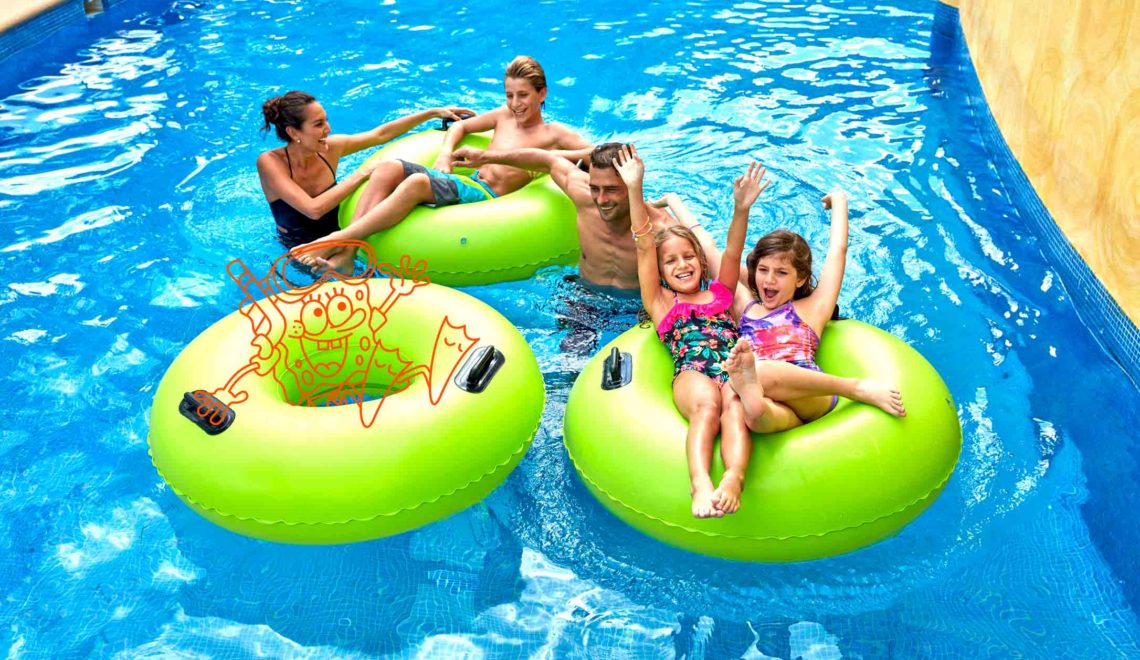 Family floating down lazy river with image of spongebob squarepants