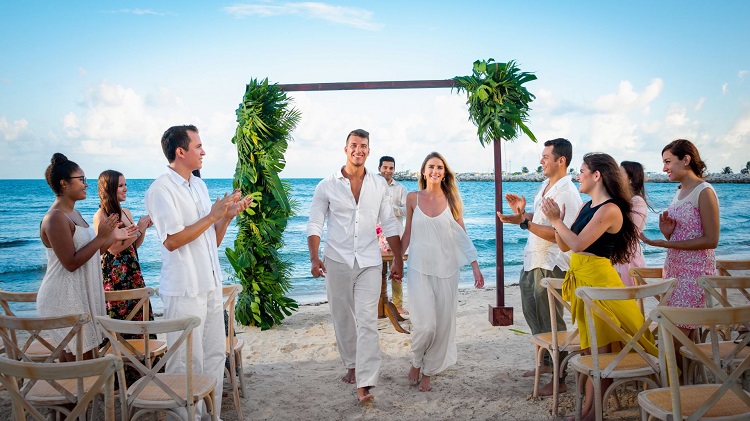 Beach wedding ceremony at Hotel Marina El Cid Spa & Beach Resort in Mexico