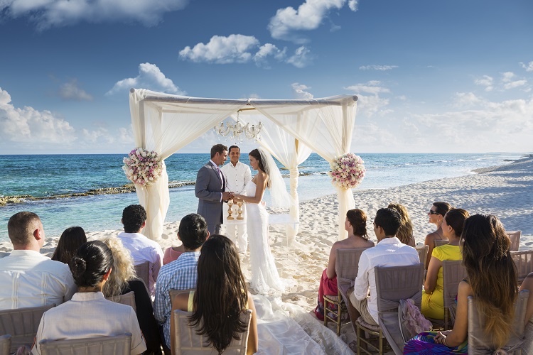 Beachfront wedding ceremony at El Dorado Seaside Suites in Riviera Maya