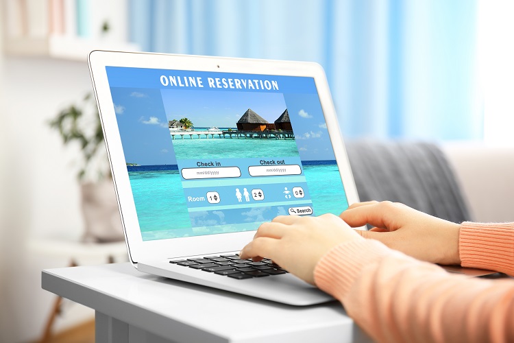 Woman booking a vacation online